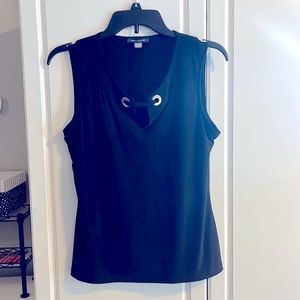 Very cute dressy tank.  95% polyester 5% spandex